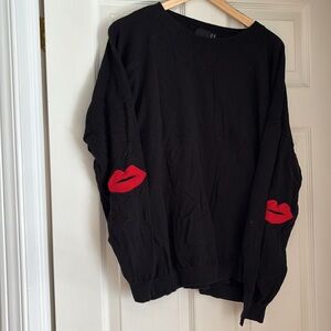 Black cotton sweater with elbow kiss patches